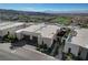 Contemporary home featuring a two-car garage, desert landscaping, and a small outdoor patio space at 431 Tranquil Peak Ct, Henderson, NV 89012