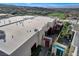 Modern home exterior with a rooftop patio and desert landscaping at 431 Tranquil Peak Ct, Henderson, NV 89012