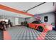 Garage space with gray walls, epoxy flooring, and a red sports car and motorcycles at 431 Tranquil Peak Ct, Henderson, NV 89012