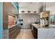 Modern kitchen with sleek cabinetry, stainless steel appliances, and a stylish island with pendant lighting at 431 Tranquil Peak Ct, Henderson, NV 89012