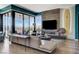 Contemporary living room with a stylish fireplace and expansive windows offering great views at 431 Tranquil Peak Ct, Henderson, NV 89012