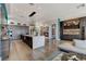 Open-concept living area with hardwood floors, modern furnishings, and plenty of natural light at 431 Tranquil Peak Ct, Henderson, NV 89012