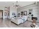 Bright, spacious main bedroom with a chandelier and stylish decor at 431 Tranquil Peak Ct, Henderson, NV 89012