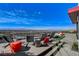 Relaxing outdoor patio features modern seating and panoramic city views at 431 Tranquil Peak Ct, Henderson, NV 89012