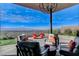 Outdoor seating area with modern furniture, a canopy, and a skyline view of the city at 431 Tranquil Peak Ct, Henderson, NV 89012