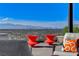 Relaxing patio area with comfortable seating and unobstructed views of the city skyline at 431 Tranquil Peak Ct, Henderson, NV 89012