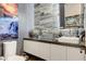 Powder room with stone backsplash, square sink, modern faucet, and gray walls at 431 Tranquil Peak Ct, Henderson, NV 89012