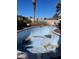 Swimming pool in need of maintenance surrounded by a yard, providing potential for outdoor enjoyment at 4637 Balfour Dr, Las Vegas, NV 89121