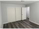 Bedroom with closet and wood-look flooring at 4661 Hutchinson Dr, Las Vegas, NV 89147