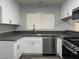 Well-lit kitchen featuring sleek countertops and stainless steel appliances at 4661 Hutchinson Dr, Las Vegas, NV 89147