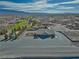 Artesia community clubhouse with ample parking, surrounding neighborhood, and mountain views at 5071 Andover Ct, Pahrump, NV 89061