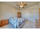 Cozy bedroom with double door closet, carpeted floor, ceiling fan and natural light at 5071 Andover Ct, Pahrump, NV 89061