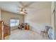 Neutral bedroom with a carpeted floor, ceiling fan, and ample natural light from a window at 5071 Andover Ct, Pahrump, NV 89061