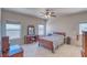 Comfortable bedroom with natural light, classic furnishings, and a ceiling fan for year-round comfort at 5071 Andover Ct, Pahrump, NV 89061