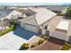 Attractive home with large driveway, three-car garage, privacy gate, and desert landscaping at 5071 Andover Ct, Pahrump, NV 89061