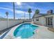 Beautiful backyard pool surrounded by mature landscaping, perfect for relaxing and entertaining at 5209 Champions Ave, Las Vegas, NV 89142