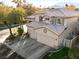 Attractive two-story home featuring a three-car garage, well-manicured lawn, and mature landscaping at 5505 Big Sky Ln, Las Vegas, NV 89149