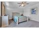 Cozy bedroom with a ceiling fan, neutral color palette, and closet with sliding doors at 5820 Delaney Falls St, North Las Vegas, NV 89081