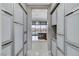 Hallway with floor-to-ceiling cabinets and views into the kitchen at 5880 Westwind Rd, Las Vegas, NV 89118