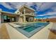 Stunning pool with built-in spa and elegant backyard with desert landscape at 5880 Westwind Rd, Las Vegas, NV 89118