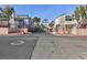 Gated townhouse community with mature landscaping, a crosswalk and lamp post at 600 Willow Green Dr, Las Vegas, NV 89169