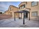 Large concrete backyard showcasing a dark pergola providing shade and privacy, ideal for relaxing or entertaining guests at 6525 Raven Hall St, North Las Vegas, NV 89084