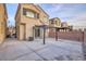 View of the home's backyard featuring a concrete patio and pergola at 6525 Raven Hall St, North Las Vegas, NV 89084