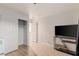 Bedroom featuring wood-look floors, closet, and a modern television at 6525 Raven Hall St, North Las Vegas, NV 89084