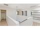 Spacious upstairs hallway features modern lighting and access to bedrooms, bathrooms, and a linen closet at 6525 Raven Hall St, North Las Vegas, NV 89084