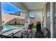 View of the covered outdoor patio with a built-in grill and a small pool at 690 Monroe Hill Pl, Henderson, NV 89011