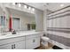 Clean bathroom featuring white cabinets, a neutral color scheme, and a shower with a striped curtain at 690 Monroe Hill Pl, Henderson, NV 89011