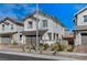 Charming two-story home with a two-car garage and nicely landscaped front yard at 690 Monroe Hill Pl, Henderson, NV 89011