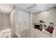 Cozy loft space with a comfortable couch and exercise bike, perfect for relaxation and fitness activities at 690 Monroe Hill Pl, Henderson, NV 89011