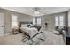 Spacious main bedroom with large windows, plantation shutters, and stylish decor, offering a tranquil retreat at 690 Monroe Hill Pl, Henderson, NV 89011