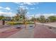 Inviting community playground featuring swings and safe, colorful play surfaces at 690 Monroe Hill Pl, Henderson, NV 89011