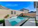 Inviting backyard with a plunge pool, waterfall feature, and lounge area at 690 Monroe Hill Pl, Henderson, NV 89011