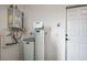 Wall mounted water heater system with door on right at 690 Monroe Hill Pl, Henderson, NV 89011