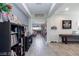 Inviting hallway with neutral walls leading to an open kitchen and living area at 7143 Nodding Thistle Ct, Las Vegas, NV 89178