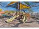 Community playground featuring slides and sunshades offering fun for neighborhood children at 7632 Calico Fields St, Las Vegas, NV 89149