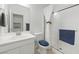 Clean bathroom with a glass-enclosed shower and a vanity with a sink at 7722 Sagamore Bay Ct, Las Vegas, NV 89179