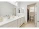 This bathroom features a double sink vanity with a separate room for the toilet at 7722 Sagamore Bay Ct, Las Vegas, NV 89179