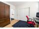 This bedroom displays a sliding door closet with a desk and a chair set at 7722 Sagamore Bay Ct, Las Vegas, NV 89179