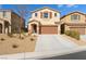 Charming two-story home featuring a two-car garage and low-maintenance xeriscape front yard at 7722 Sagamore Bay Ct, Las Vegas, NV 89179
