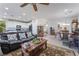 Bright living room seamlessly connects to the kitchen and dining area at 7722 Sagamore Bay Ct, Las Vegas, NV 89179