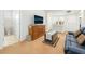 This living room features an entertainment center and a comfy blue couch at 7722 Sagamore Bay Ct, Las Vegas, NV 89179