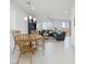 Open-concept living and dining area with modern furnishings and plenty of natural light at 7722 Sagamore Bay Ct, Las Vegas, NV 89179