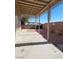 Backyard featuring a covered patio, desert landscaping, and a block wall for privacy at 8125 Rio De Janeiro Dr, Las Vegas, NV 89128