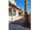 Backyard featuring a covered patio, desert landscaping, and a block wall for privacy at 8125 Rio De Janeiro Dr, Las Vegas, NV 89128