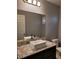 Bathroom featuring a granite countertop and a modern vessel sink at 8125 Rio De Janeiro Dr, Las Vegas, NV 89128