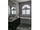 A modern bathroom features dual sinks, soaking tub and a window at 8125 Rio De Janeiro Dr, Las Vegas, NV 89128